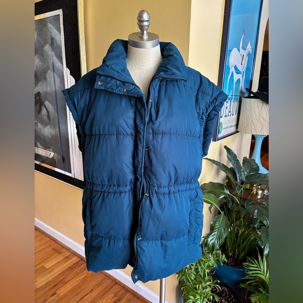 teal puffy vest